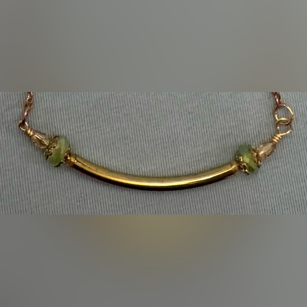 Gold Tone Curved Bar Necklace with Light Green Bead Accents